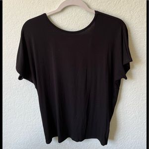 NWOT Black pullover tee with twist back in rayon fabric.